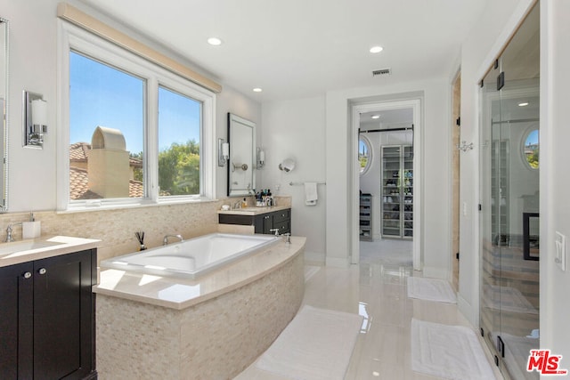 bathroom featuring vanity and plus walk in shower