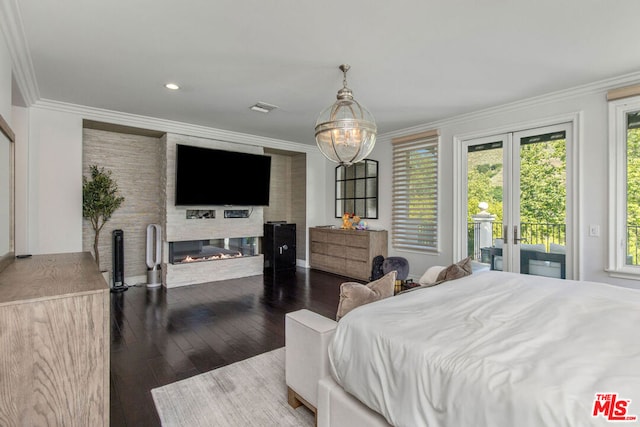 bedroom featuring hardwood / wood-style flooring, crown molding, and access to outside