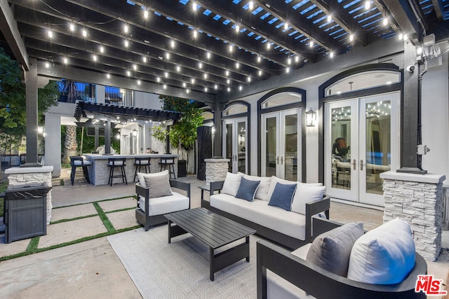 view of patio with a pergola, an outdoor hangout area, an outdoor bar, and french doors