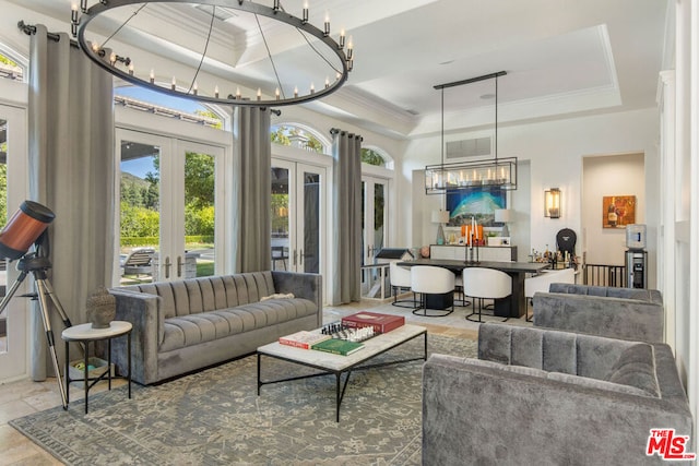 interior space featuring french doors and a raised ceiling