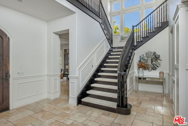 entryway featuring a high ceiling