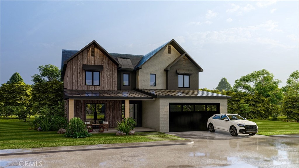 view of front of house with a garage and a front yard