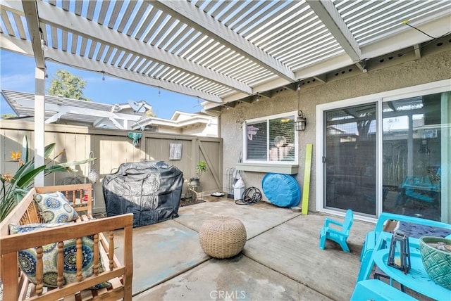 view of patio / terrace featuring a grill and a pergola