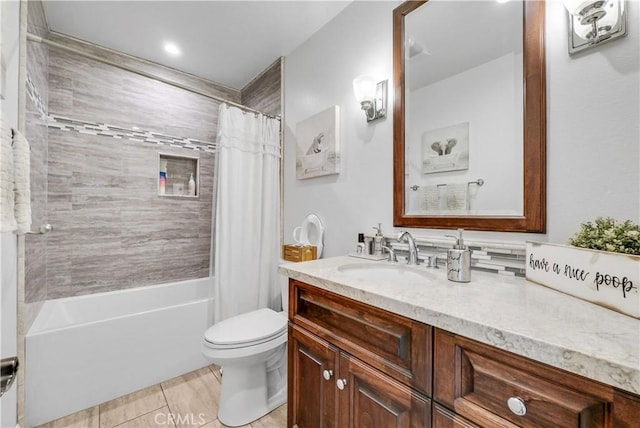 full bathroom featuring vanity, shower / bath combination with curtain, and toilet