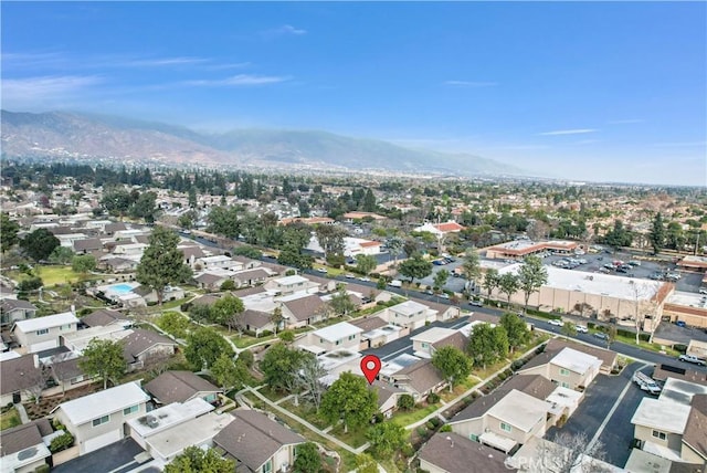 birds eye view of property featuring a mountain view