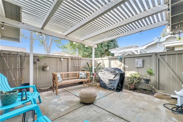 view of patio with a grill and a pergola