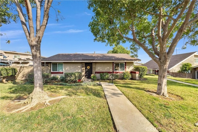 ranch-style house with a front lawn