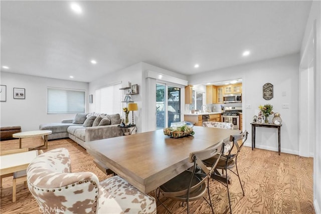 dining area with light hardwood / wood-style floors