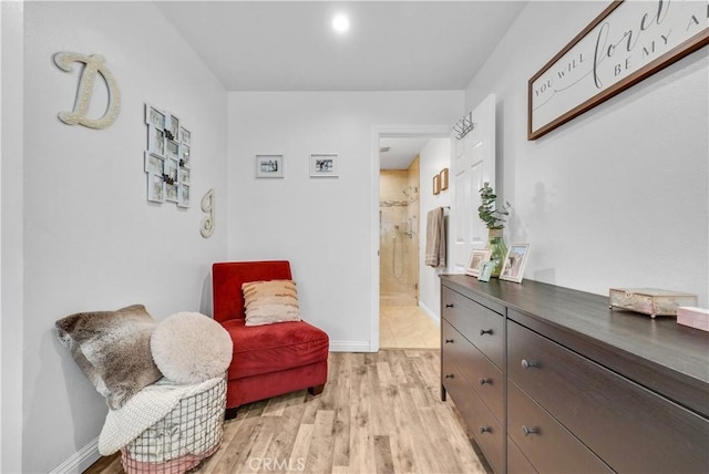 sitting room with light hardwood / wood-style flooring