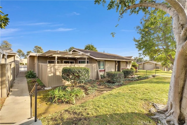 single story home featuring a front yard