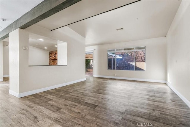 interior space with hardwood / wood-style flooring and plenty of natural light