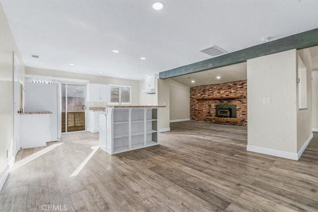 unfurnished living room featuring light hardwood / wood-style floors