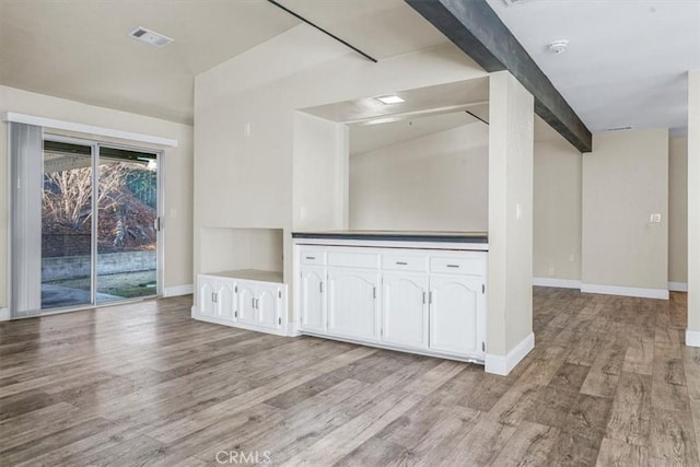 unfurnished living room featuring light wood-type flooring