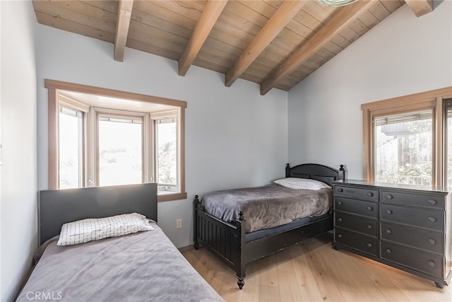 bedroom with wood ceiling, light hardwood / wood-style floors, and lofted ceiling with beams