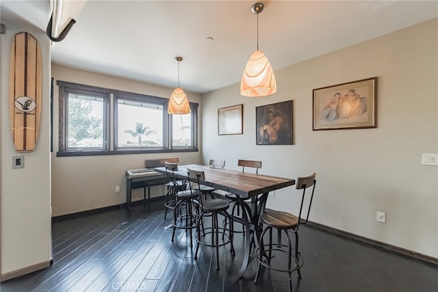 dining space featuring dark hardwood / wood-style flooring