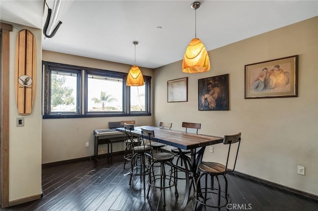 dining room with dark wood-type flooring