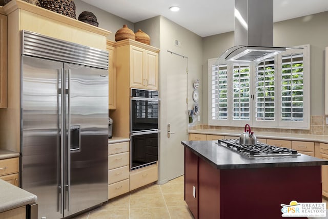 kitchen featuring tasteful backsplash, appliances with stainless steel finishes, light tile patterned floors, and island range hood