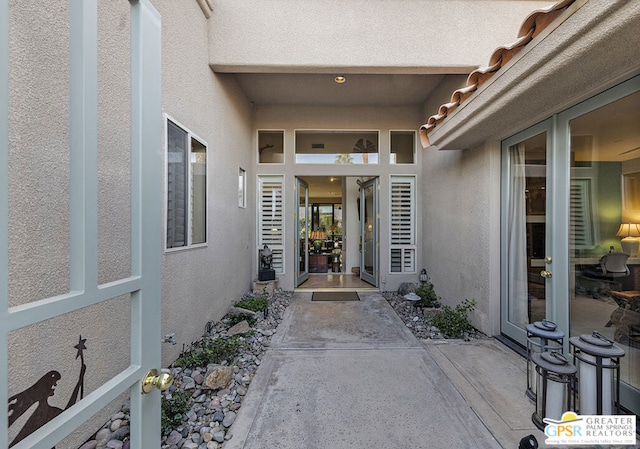 entrance to property featuring a patio