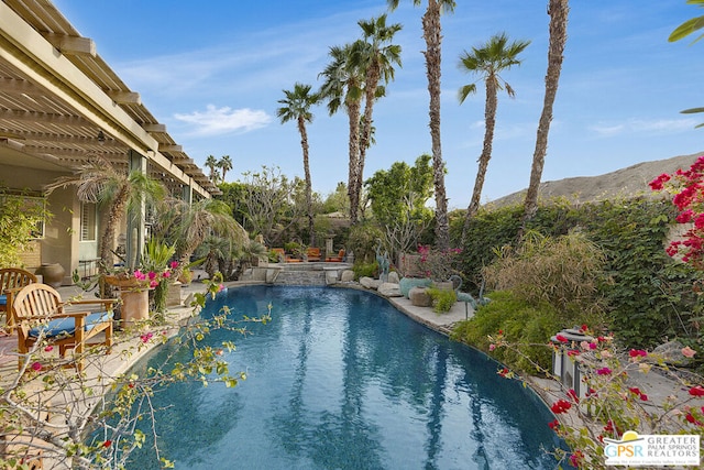 view of swimming pool featuring a mountain view