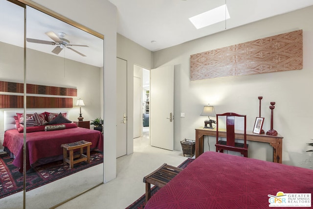 bedroom with ceiling fan and a skylight