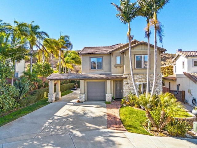 mediterranean / spanish-style house with a garage