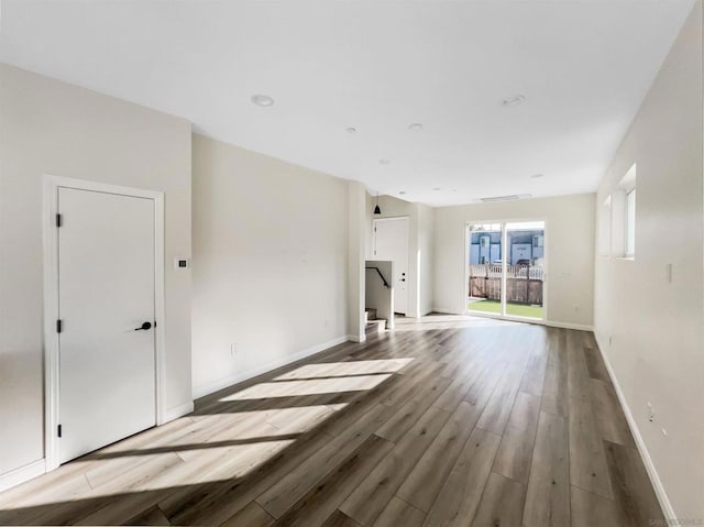 unfurnished living room featuring light wood-type flooring