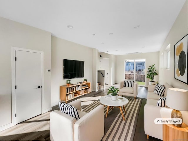 living room with light hardwood / wood-style floors