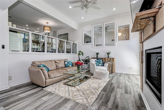 living room featuring hardwood / wood-style flooring and ceiling fan