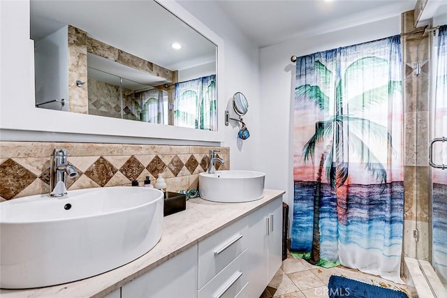 bathroom featuring vanity, an enclosed shower, tile patterned flooring, and decorative backsplash