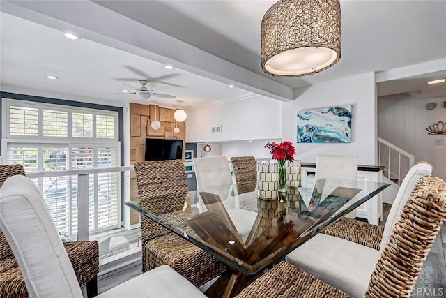 dining area with ceiling fan and beam ceiling