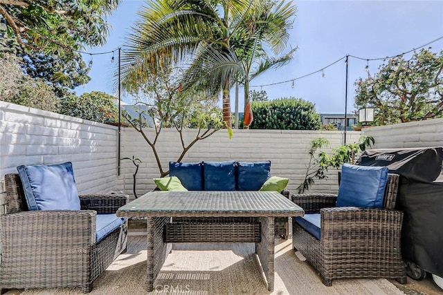 view of patio / terrace featuring an outdoor living space and a fenced backyard