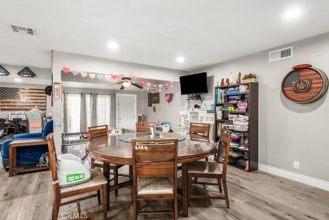 dining space featuring light wood-type flooring