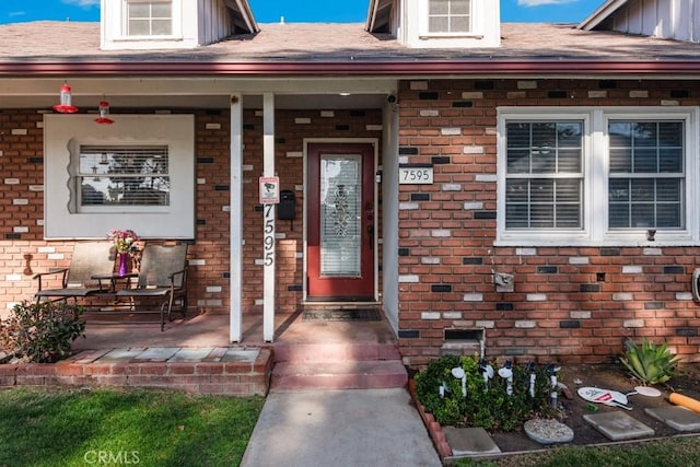 property entrance featuring covered porch