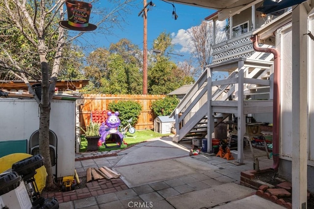 view of patio / terrace featuring a storage unit