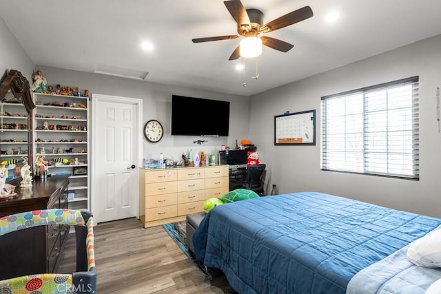 bedroom featuring hardwood / wood-style floors and ceiling fan