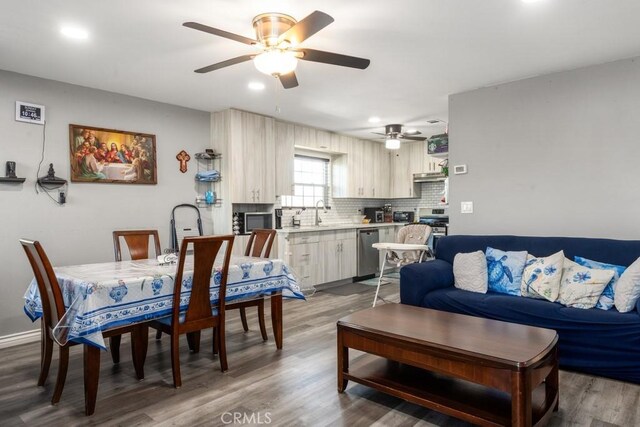 interior space featuring sink, hardwood / wood-style floors, and ceiling fan