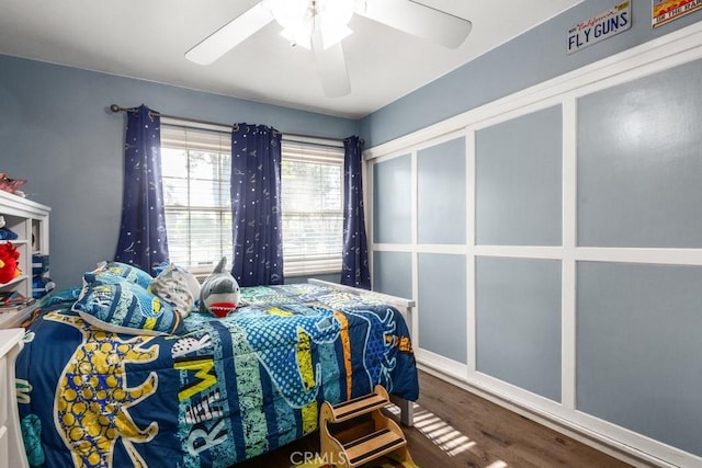 bedroom featuring hardwood / wood-style floors and ceiling fan