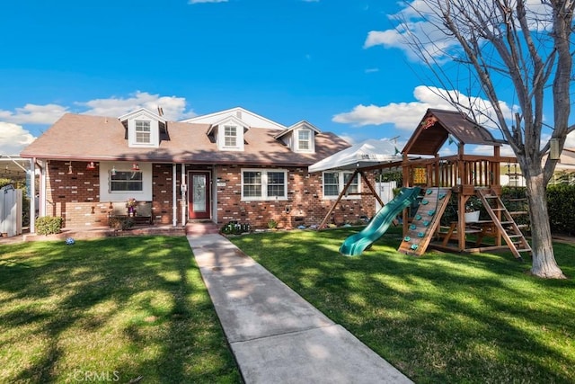 view of front facade featuring a playground and a front lawn