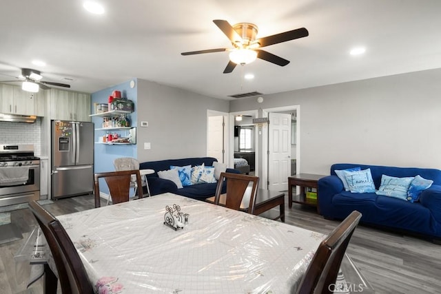 dining room featuring ceiling fan and hardwood / wood-style floors