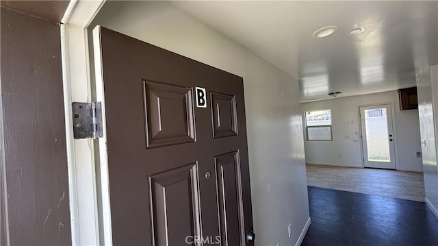 foyer with dark hardwood / wood-style floors