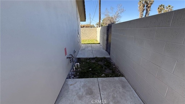 view of side of property with a patio