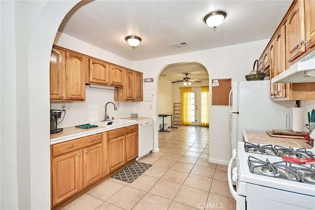 kitchen featuring ceiling fan, white appliances, sink, and light tile patterned floors