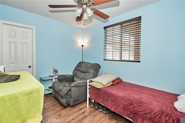 bedroom featuring ceiling fan and light wood-type flooring