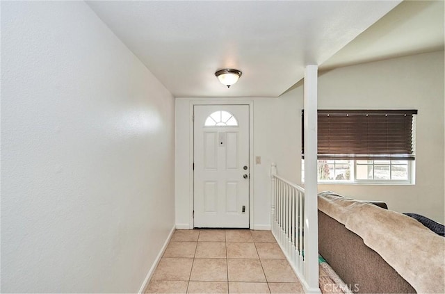 foyer featuring light tile patterned flooring