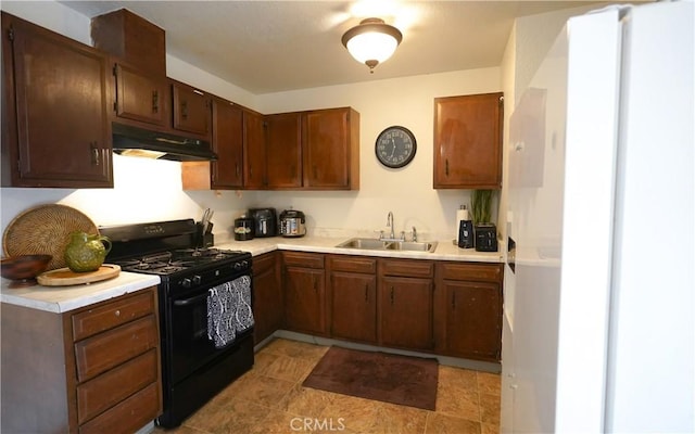 kitchen featuring sink and black gas stove