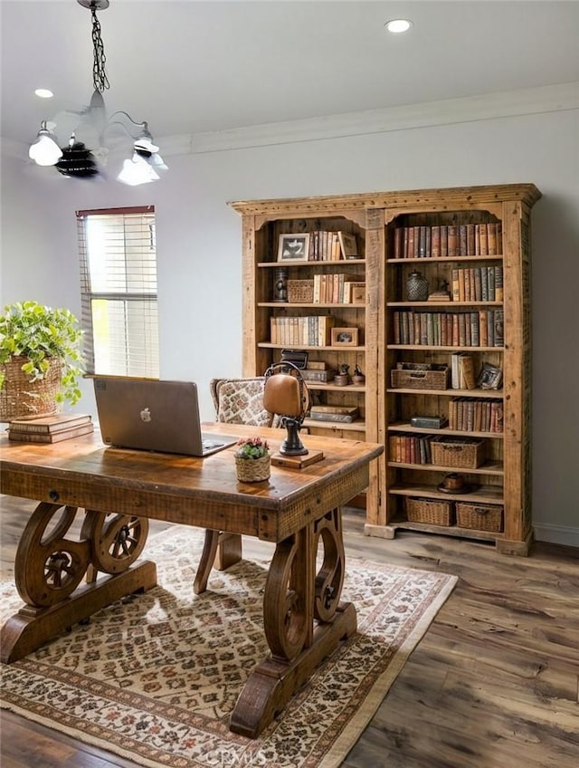 office space featuring a notable chandelier, recessed lighting, wood finished floors, and crown molding