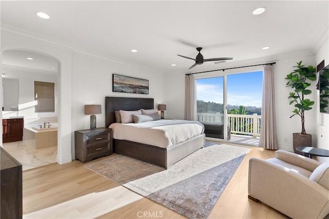 bedroom featuring light hardwood / wood-style flooring, crown molding, access to exterior, and connected bathroom