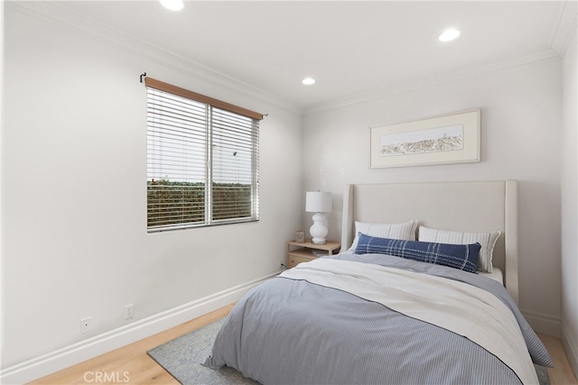 bedroom featuring ornamental molding and wood-type flooring