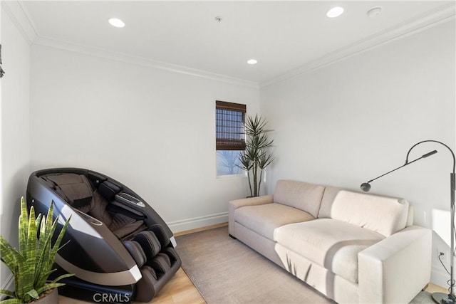 living room with ornamental molding and light hardwood / wood-style floors