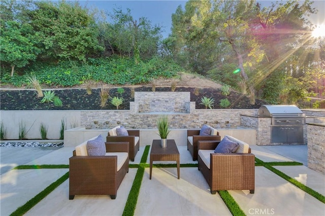 view of patio / terrace featuring area for grilling and an outdoor hangout area